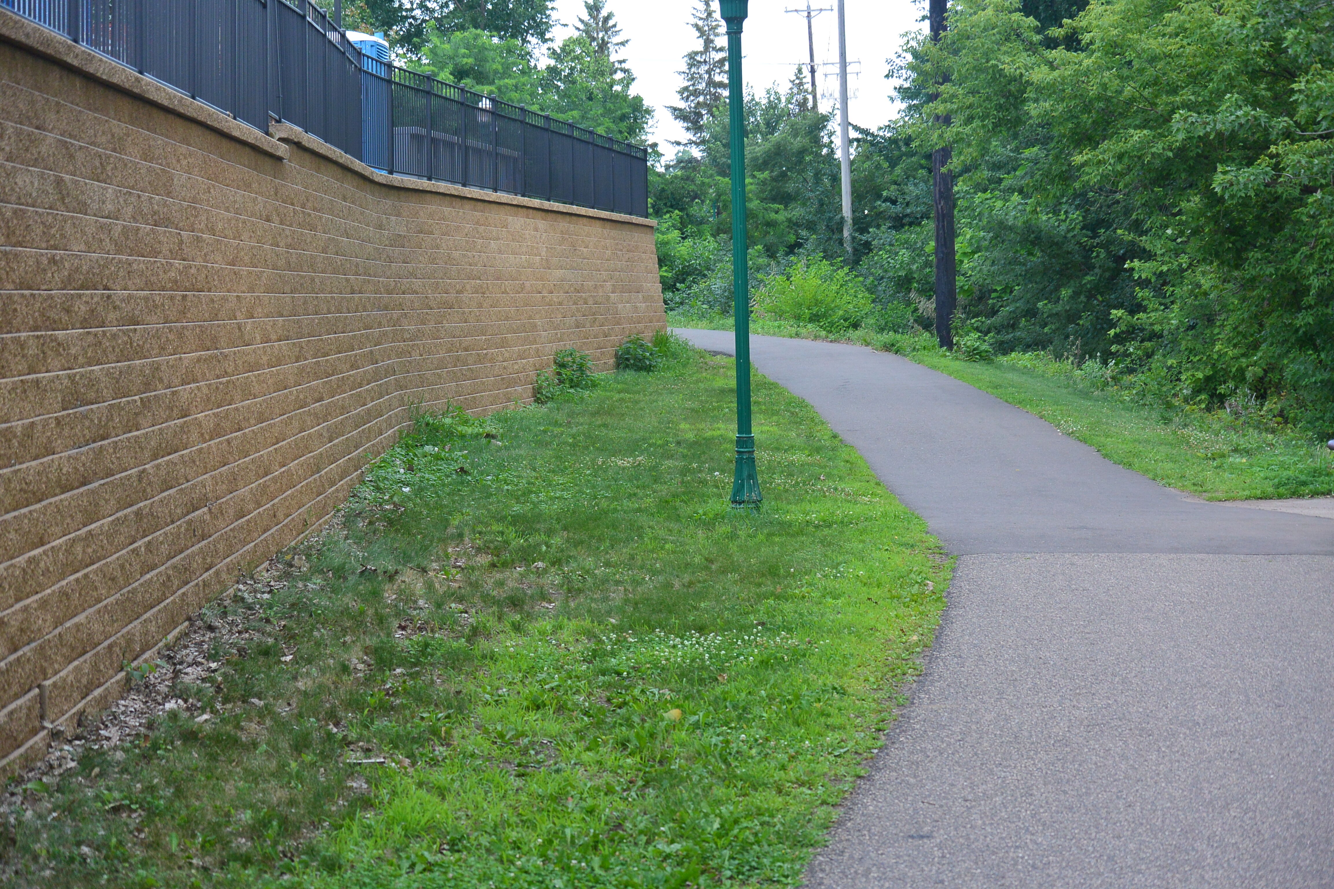 For the 500-foot-long wall, Landscape Reflections Inc. of Oakdale, Minn., installed 3,800 square feet of VERSA-LOK Standard units and 2,200 square yards of the manufacturer’s geogrid soil reinforcement product.